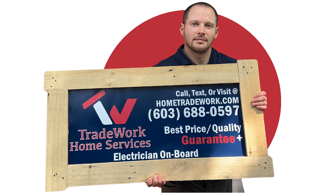Electrician Holding Sign