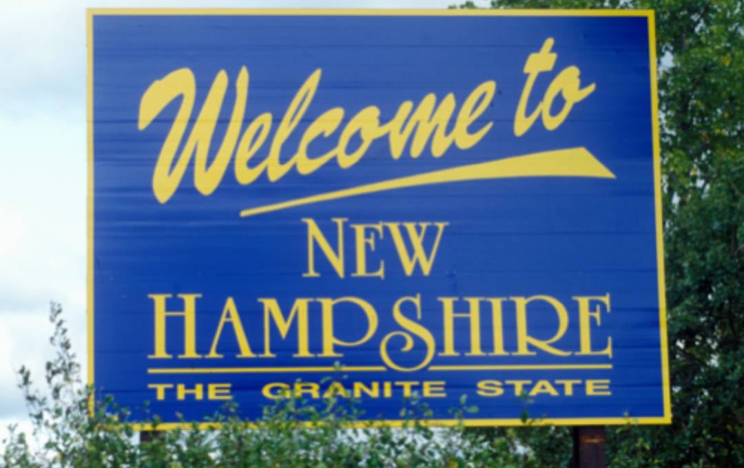 Welcome road sign to New Hampshire.